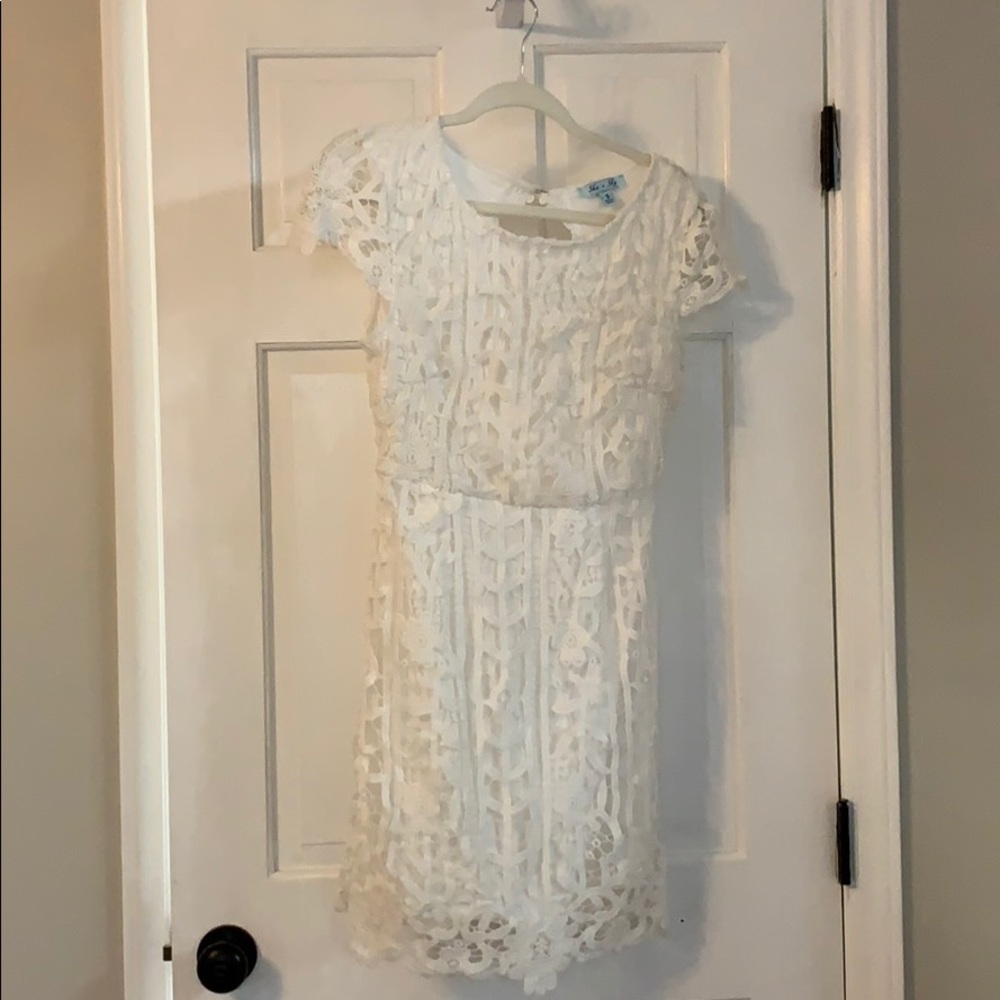 White mini lace dress with open back